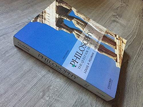 Book on philosophy titled 'Philosophy: The Quest for Truth' by Louis P. Pojman on a wooden surface.
